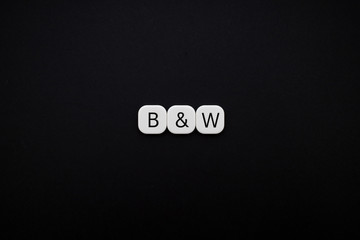 Alphabet Black and white word block with black background.