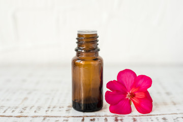 Geranium oil in glass dark bottles. Pelargonium oil. Aromatherapy