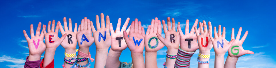 Children Hands Building Colorful German Word Verantwortung Means Resposibility. Blue Sky As Background
