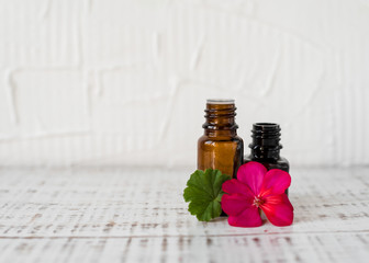 Geranium oil in glass dark bottles. Pelargonium oil. Aromatherapy
