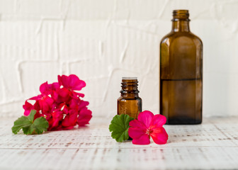 Geranium oil in glass dark bottles. Pelargonium oil. Aromatherapy