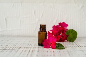 Geranium oil in glass dark bottles. Pelargonium oil. Aromatherapy