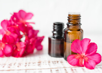 Geranium oil in glass dark bottles. Pelargonium oil. Aromatherapy