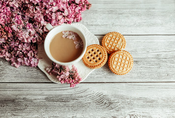 lilac, a cup of coffee and cookies