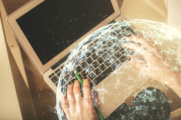 Double exposure of woman hands working on computer and social network theme hologram drawing. Top View. People connection concept.