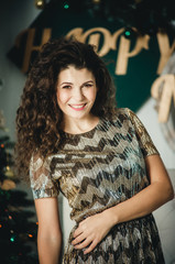 Fototapeta premium beautiful and happy girl near new year tree