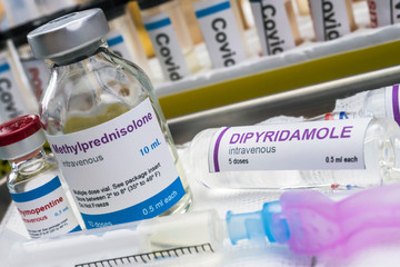 Diverse medication prepared to treat Kawasaki disease related to Sars-CoV-2 in children under one year old, conceptual image, unbranded generic drug containers and hypothetical bar codes