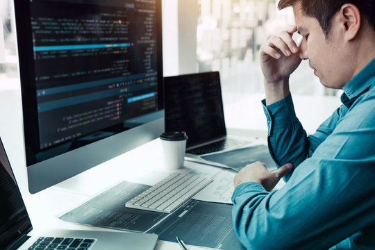 Software developers headache with code analysis in the office.