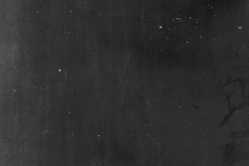 Cement wall with black fungus attached to the pattern.