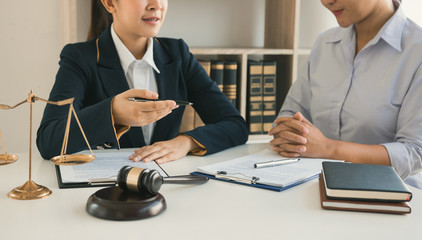 Woman judge is currently advising clients on their requests for legal proceedings and legal advice.