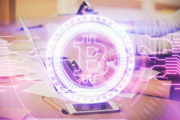 Double exposure of woman hands typing on computer and crypto market theme hologram drawing. Blockchain concept.