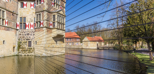 Panorama of Burg Vischering reflected in the mirror in Ludinghausen, Germany