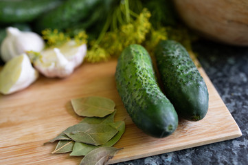 fresh cucumbers on a wooden board