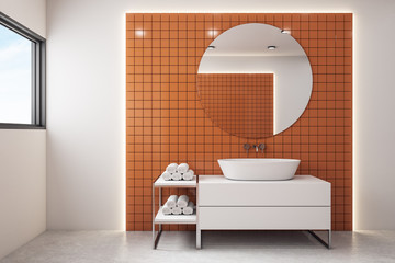 Modern orange bathroom with mirror