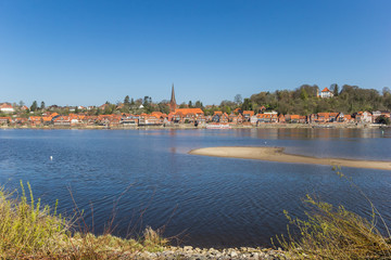Fototapeta na wymiar View over historic city Lauenburg from across the river Elbe in Germany