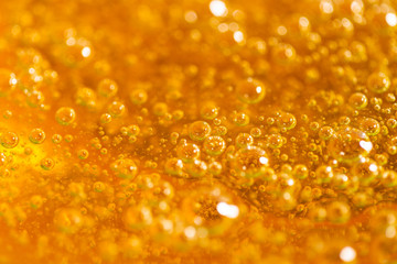 Detail of abstract orange bubble, can be used for background. Paste for sugaring close-up....
