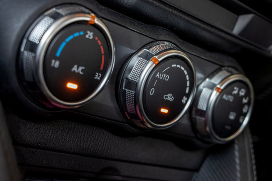 Air conditioning controls on the car dashboard. Close up car ventilation system, details of controls of modern car.