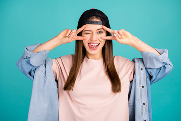 Close-up portrait of nice-looking attractive lovely cute cheerful cheery straight-haired girl showing v-sign on eyes licking lip having fun isolated on bright vivid shine vibrant blue color background