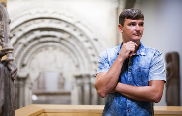 Man visiting exposition of historical museum