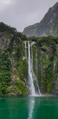 Obraz premium Beautiful Milford Sound in New Zealand and it's waterfall. 