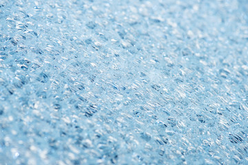 close up view of abstract blue ice textured background