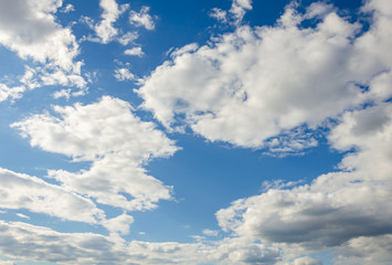 White clouds against a blue sky.