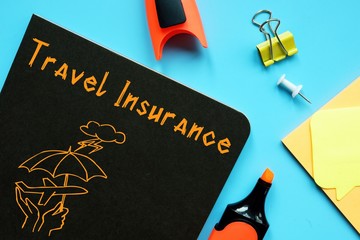 Business concept about Travel Insurance with sign on the sheet.