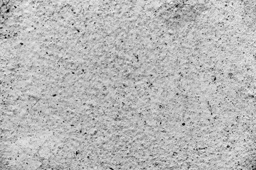 Texture of a concrete wall with cracks and scratches which can be used as a background