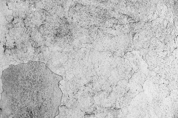 Texture of a concrete wall with cracks and scratches which can be used as a background