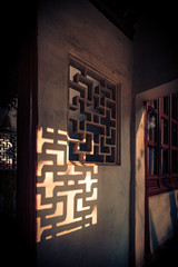 Sunlight shines on the wall, abstract Chinese style windows.