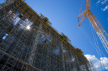 Construction site with a crane, ready-made construction of the building.