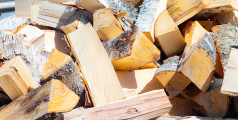Background of firewood, article about chopping firewood, stove heating