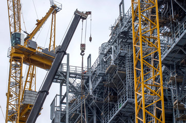 Type of metal structures of a large plant, overpasses, communications, cranes, pipes. Large-scale...