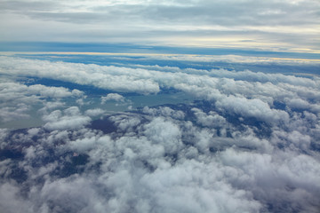 Fototapeta na wymiar flight over the clouds and lake