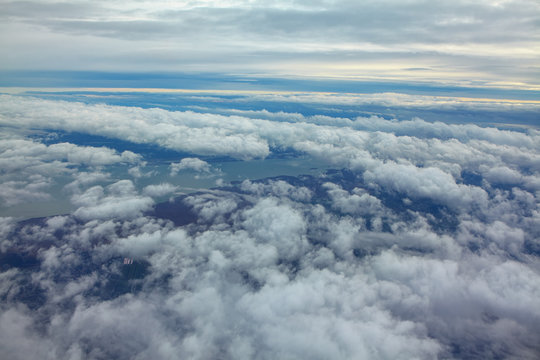 flight over the clouds and lake