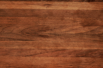 The texture of the countertop is dark brown wood with space for text signatures. The wooden surface...