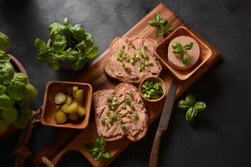 Fototapeta na wymiar Chicken or goose liver pate sandwiches on a wooden board