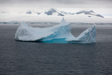 Antarctica landscape with icebergs and on a cloudy winter day