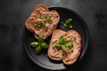 Chicken or goose liver pate sandwiches on a plate