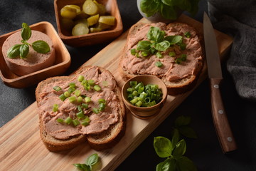 Chicken or goose liver pate sandwiches on a wooden board
