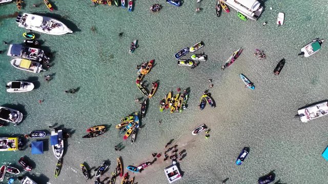 Haulover Sandbar, Florida people relaxing on kayaks and on boats from above