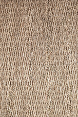 straw wicker brown rug on a wooden floor