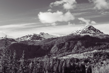 Obraz premium Black and white, snow covered mountain, cloudy.
