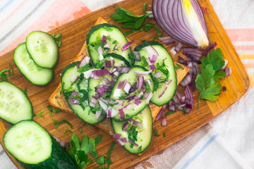 sandwich with cucumber, red onion and hummus