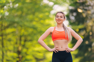 Fototapeta premium Sporty woman runner jogging during outdoor workout in park. Heal