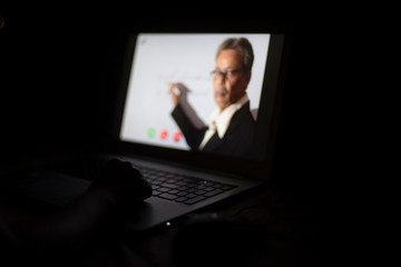 Hands pf an Indian woman on laptop keypad while attending online classes in home isolation due to corona virus. Covid-19, quarantine and lockdown. Online teaching, video lectures and tutorials