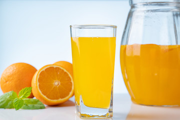 Glass with summer healthy lemonade, cocktail of with orange and ice