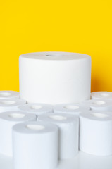 Rolls of toilet paper on color background
