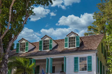 Green Shutters on Dormers of old house in Key West