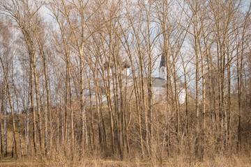 temple Church on the hill through the trees